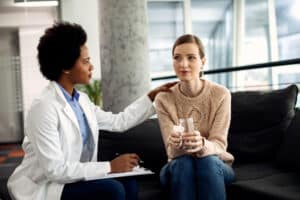 psychiatrist comforting a crying woman, combined therapy and medication massachusetts