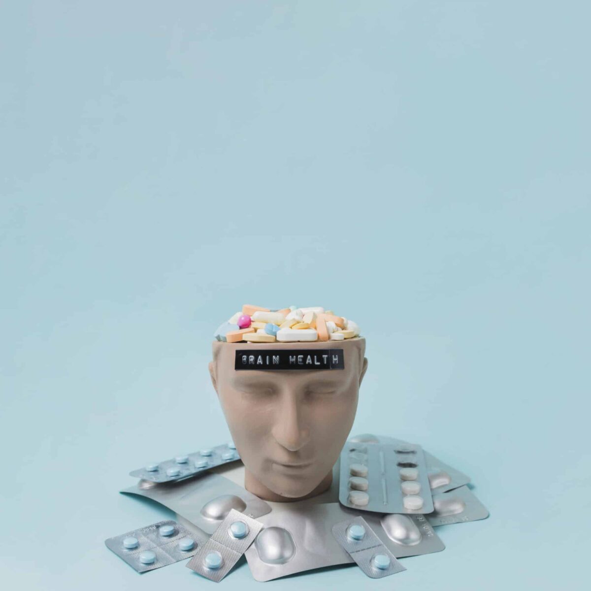 dummy humans head with medication on its head and around it, massachusetts psychopharmacology