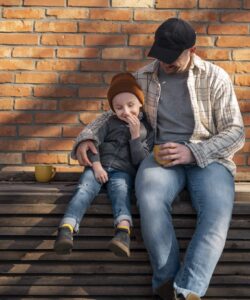 a father and a son sitting, parent guidance in boston