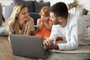 family laying on the floor while having an online therapy, family therapy massachusetts
