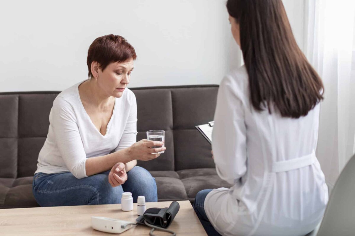 a woman consuming her medication while combining therapy and medication