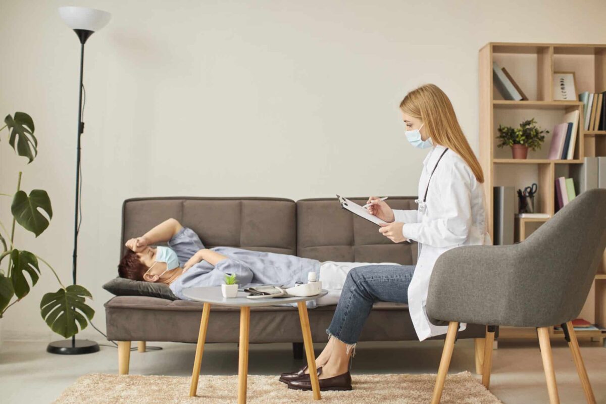 Side view of woman with face mask, doing therapy with a man, combined treatment massachusetts