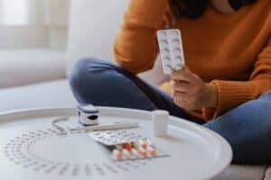 woman-self-medicates-medical-care-illness-treatment