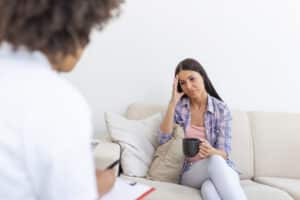 Woman at therapy session. Attentive psychologist, best psychotherapist in boston