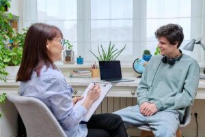 A woman and a boy talking about mental health. Psychiatric evaluation in Massachusetts