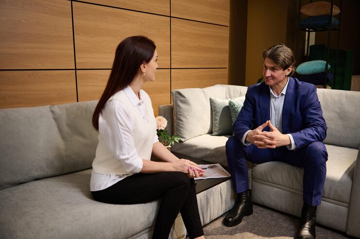 A woman and a man talking about mental health