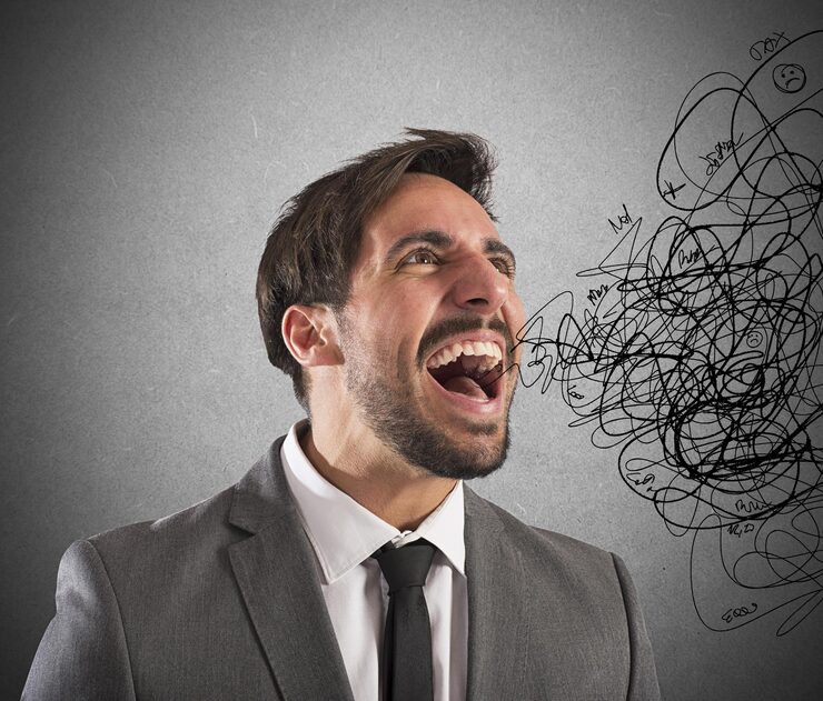 Man appearing distressed, speaking to himself repeatedly as he experiences intrusive and uncontrollable thoughts