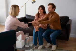Parent attending a psychotherapy session to discuss parenting challenges and emotional well-being