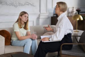 Woman and girl discussing mental health