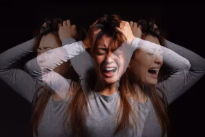 Woman screaming in panic, appearing terrified and overwhelmed by intense anxiety, panic disorder treatment massachusetts