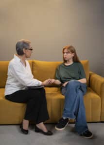 a psychiatrist and a young woman holding hands, second opinion boston ma