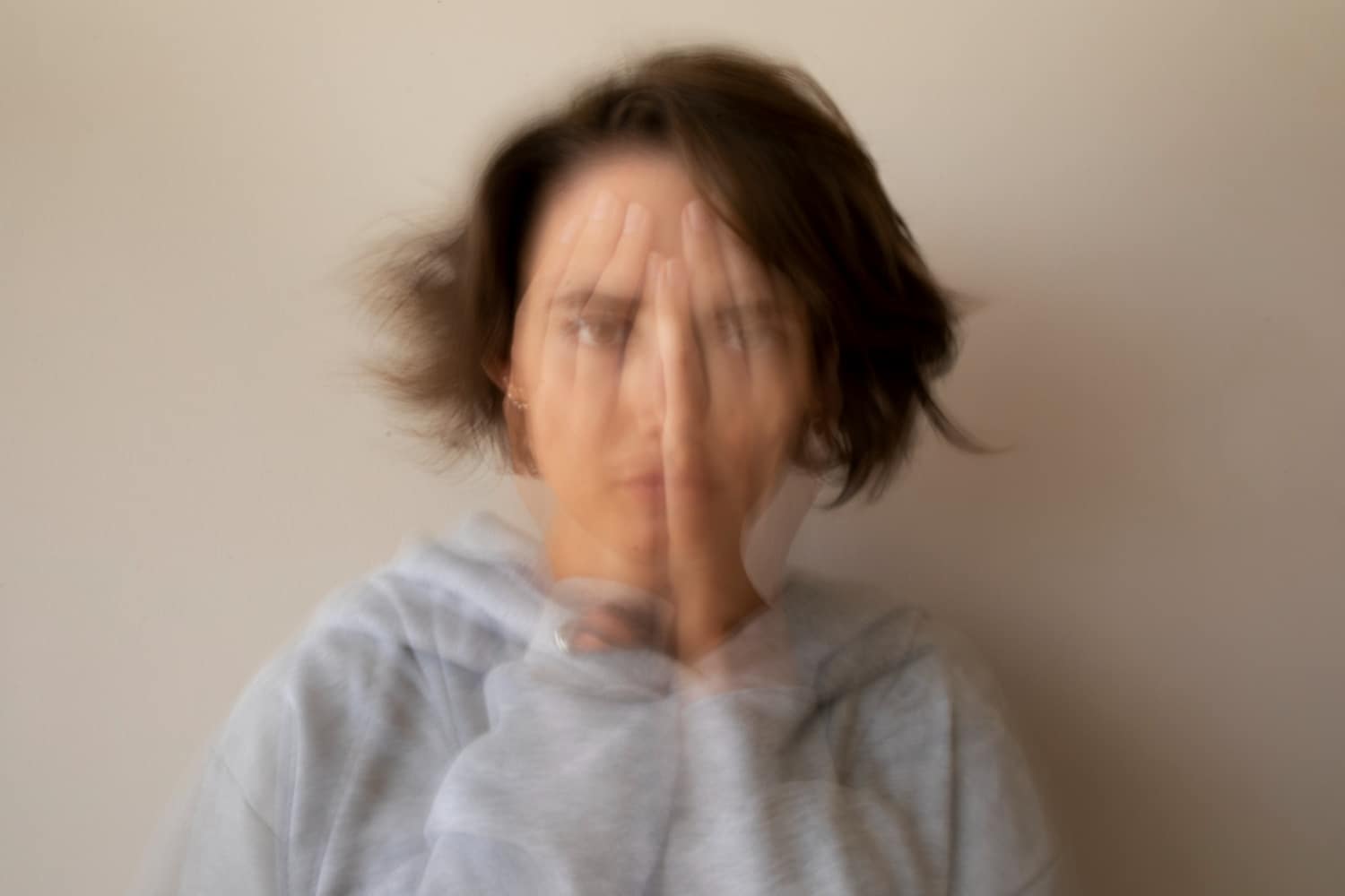 blurry woman dealing with anxiety and panic attack