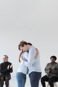 two persons hugging and comforting each other, social anxiety treatment massachusetts