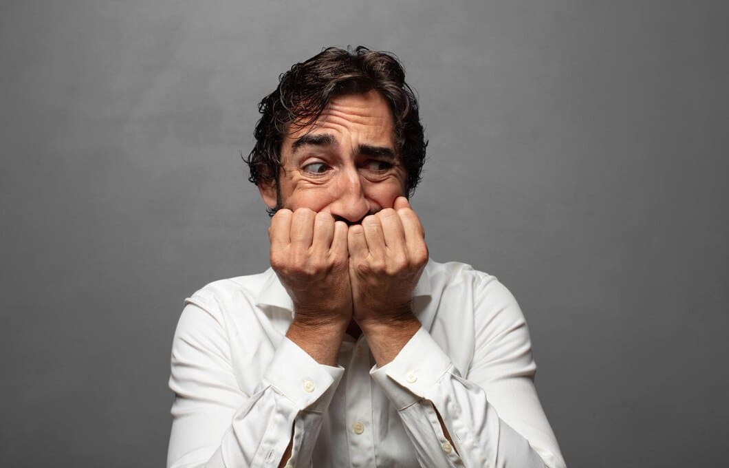 looking-worried-anxious-stressed-afraid-biting-fingernails-looking-lateral