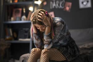 sad girl sitting down, child psychiatrist massachusetts