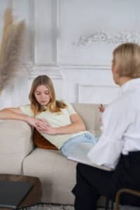 therapist and young girl talking about how second opinions work in massachusetts