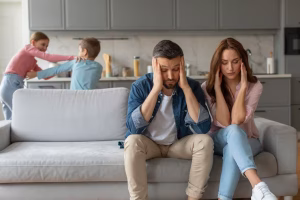 stressed-parents-with-kids-playing