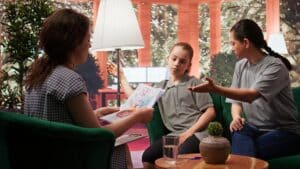 Therapist presenting unsettling dangerous drawings to mother, psychotherapy teens in massachusetts