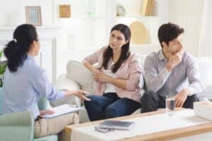 woman-psychologist-offers-guidance-young-couple-helping-them-navigate-their-relationship