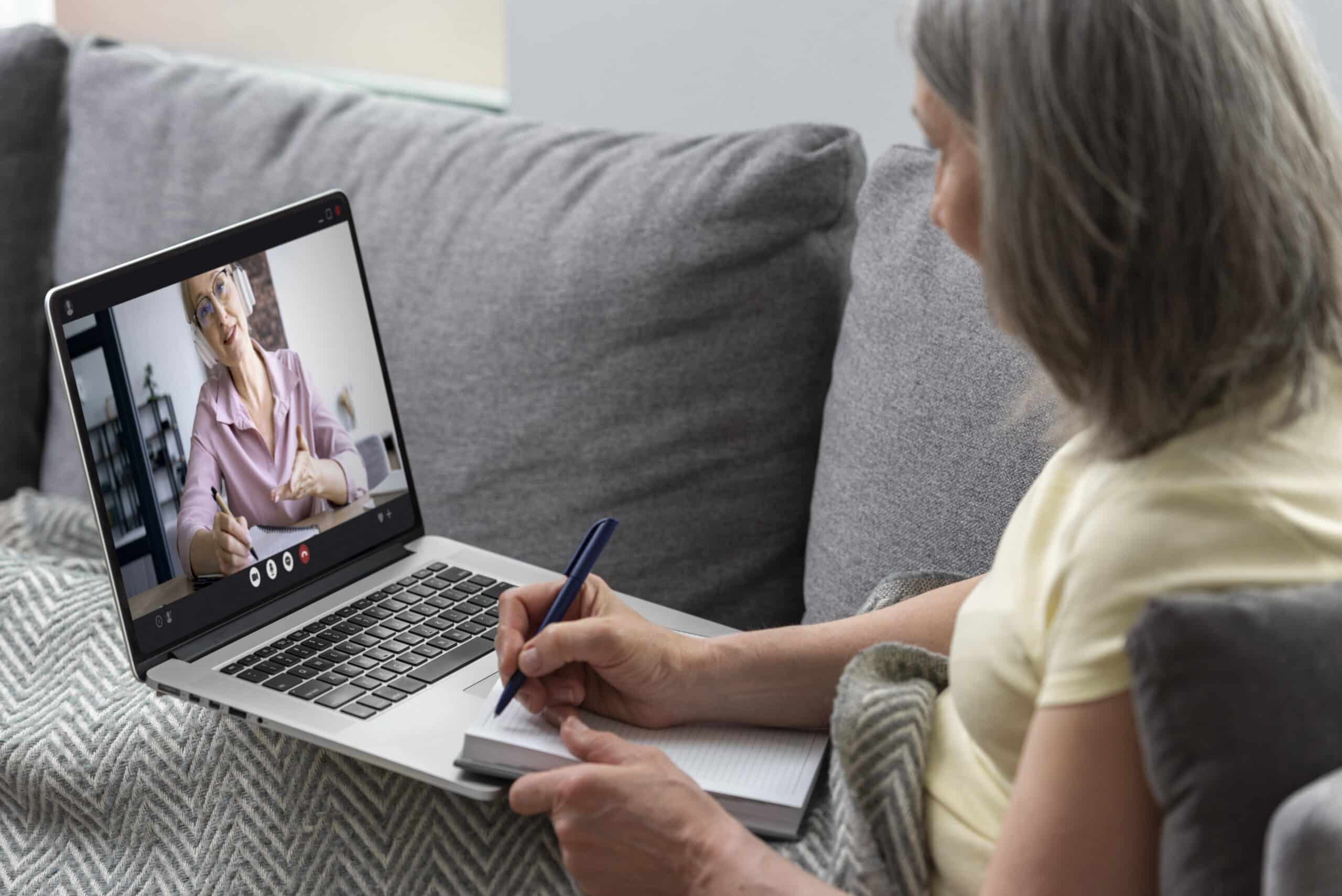 Elder woman asking for mental health support from a psychiatrist during an online video session, illustrating telepsychiatry Massachusetts care for older adults