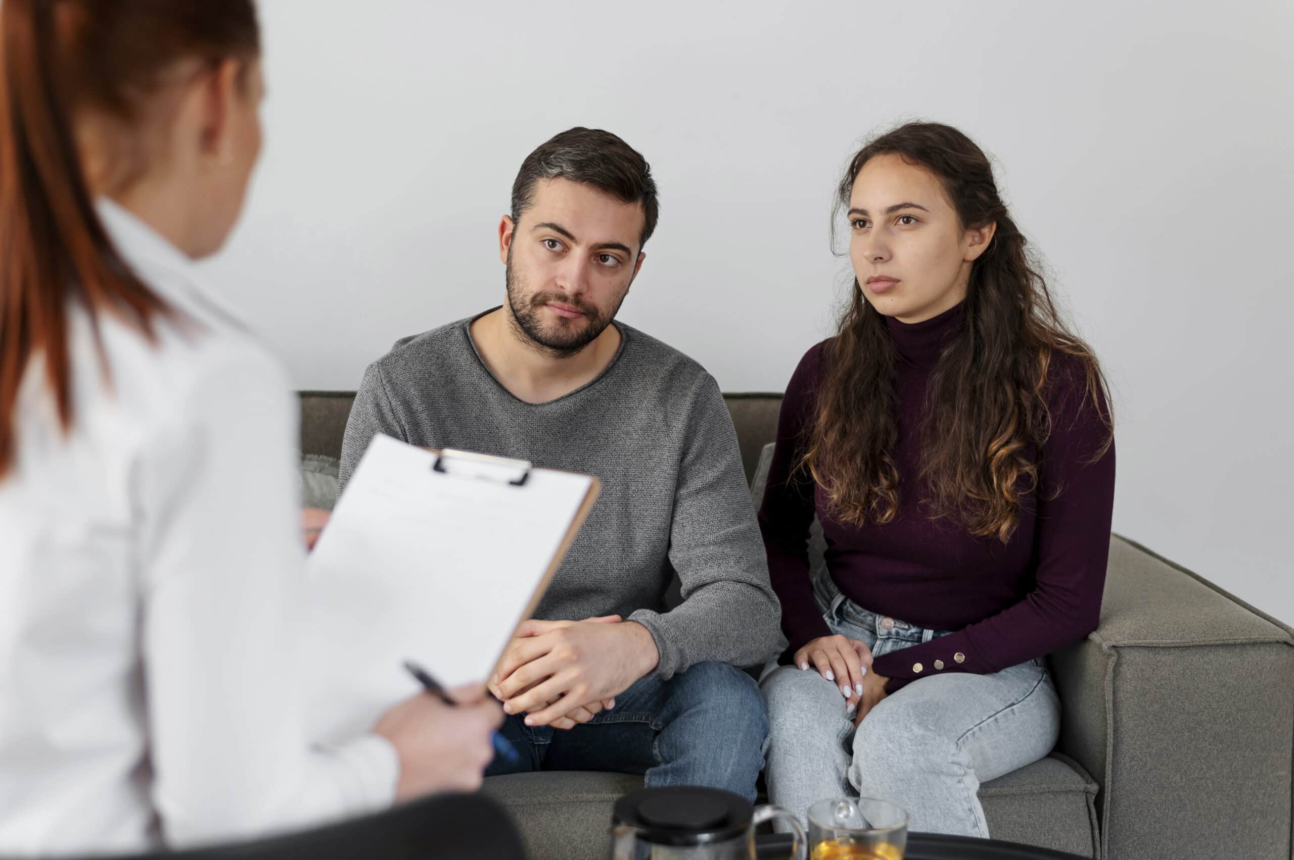 People discussing concerns with a therapist during a psychiatric evaluation Tremont Street and Boylston Street Boston
