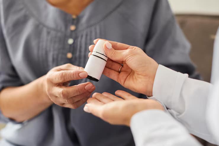 Psychiatrist discussing medication management MA with an older woman during a mental health consultation