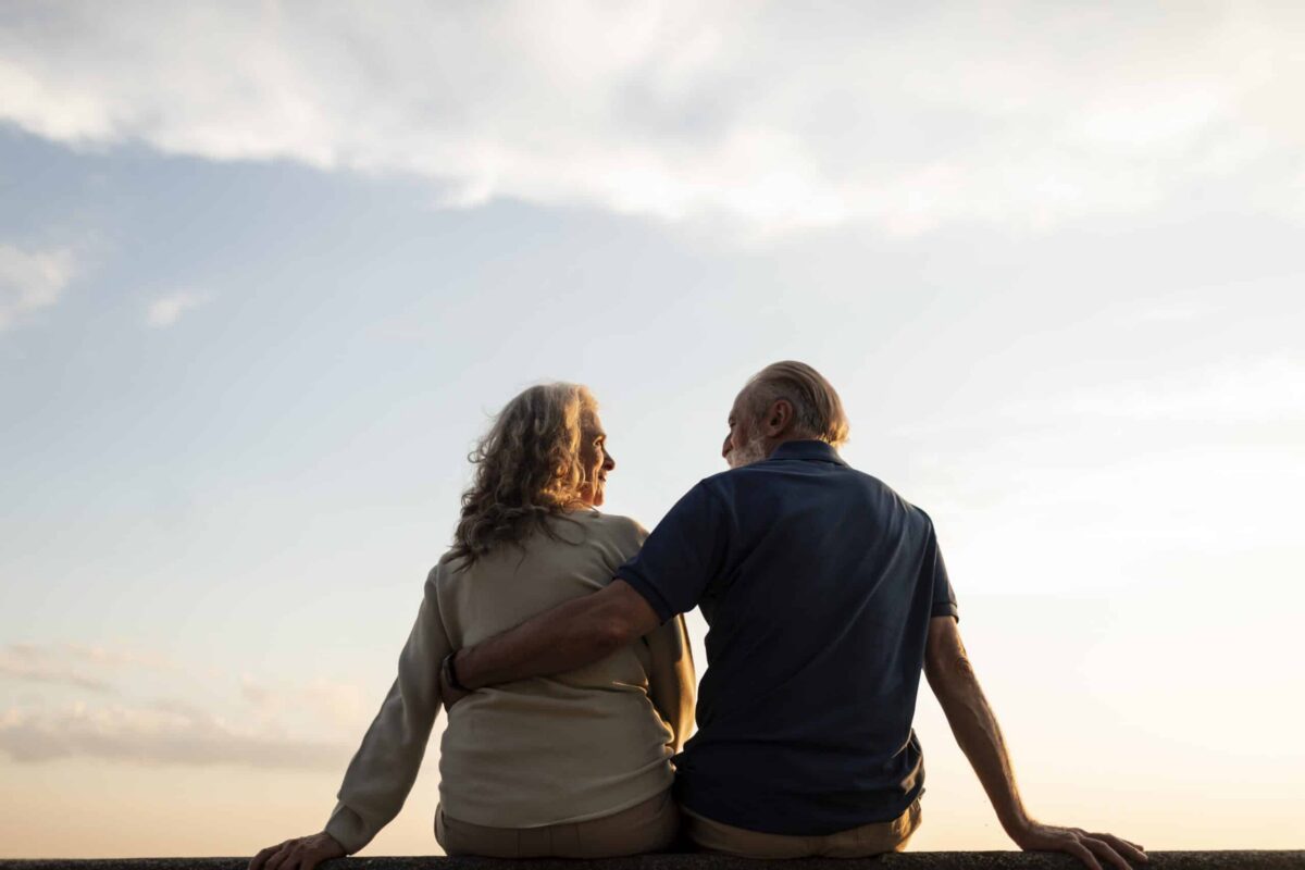 romantic couple outdoors, enjoying a peaceful moment together, highlighting the importance of support for those facing retirement depression in Massachusetts