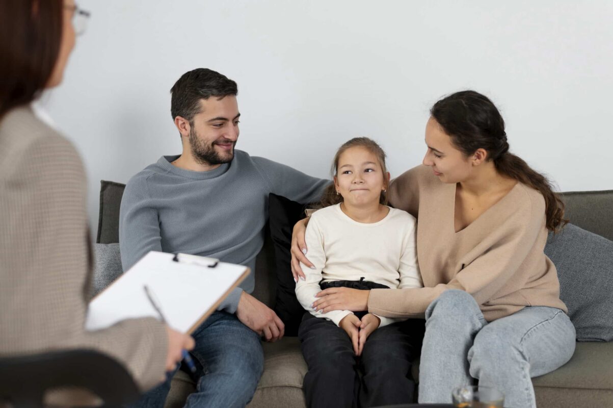 Child attending a supportive therapy session with their parents, guided by a compassionate child psychiatrist near me in Boston, Massachusetts