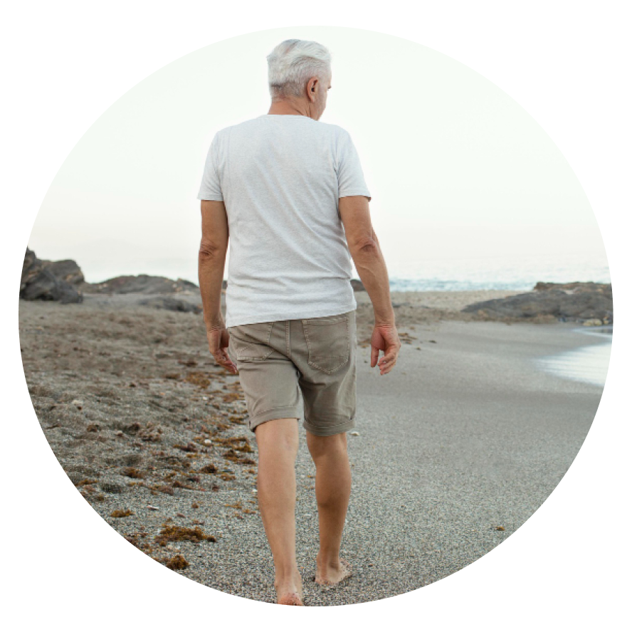 Boston Premier Psychiatry Old Man Walking on Sand Beach Wellesley Massachusetts