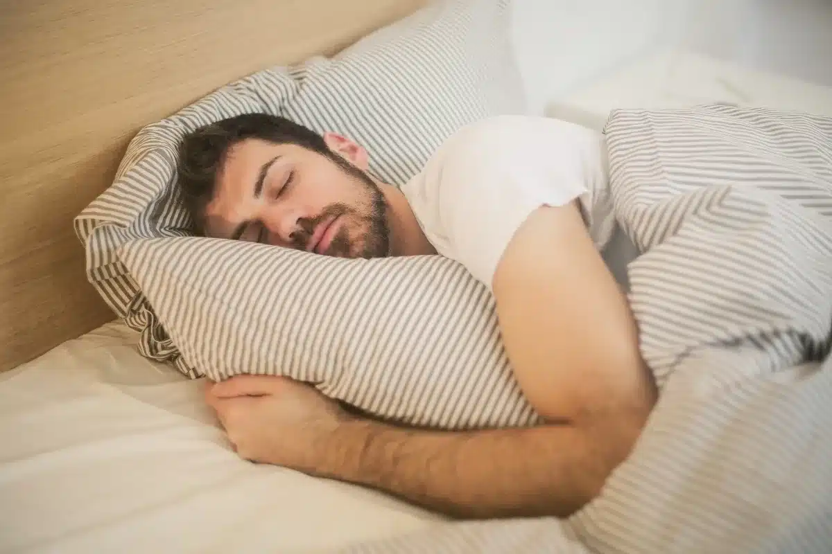 Person following a calming evening routine to support sleep and mental health