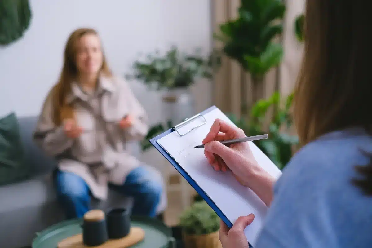 Patient preparing questions during a telepsychiatry appointment with a psychiatrist in Massachusetts